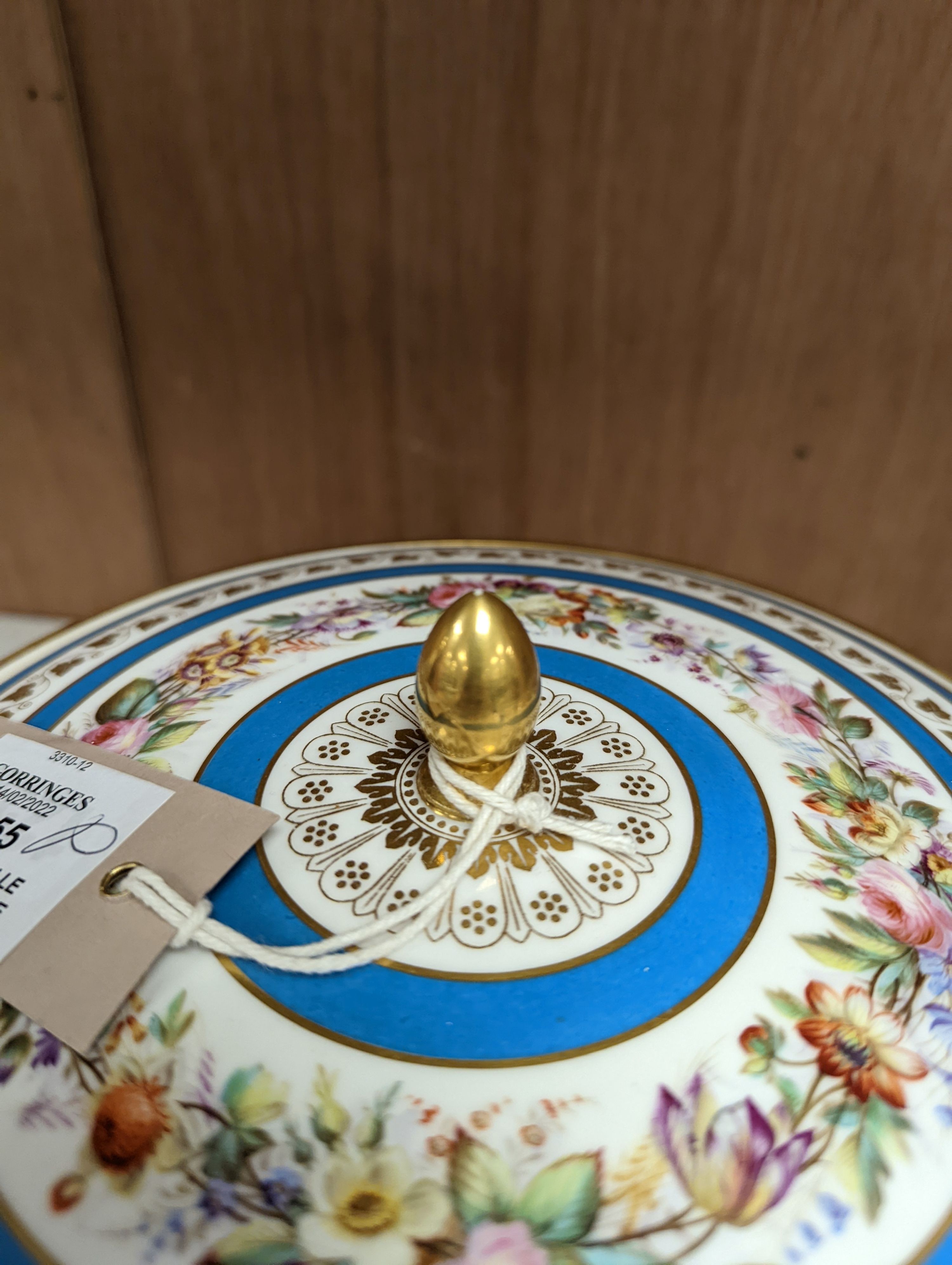 Sevres ecuelle and cover painted with a band of flowers surrounding the gilt monogram of Louis Phillipe, blue mark dated 1850, red mark for Chateau de Compiegne 25cm